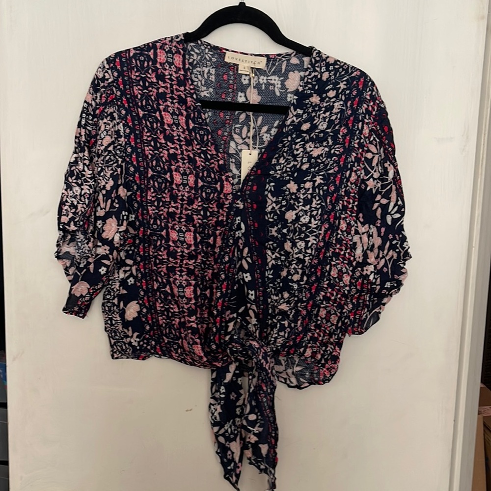 Small Lovestitch blouse. Blue, white, pink and hot pink floral.